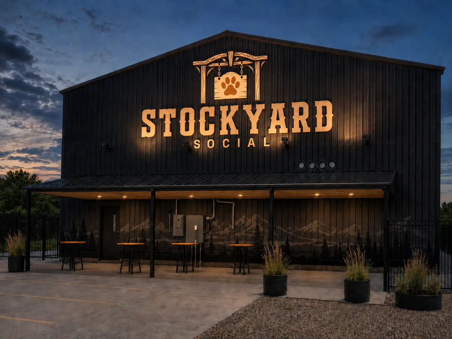 Concept of the Stockyard Social exterior with the new trail-gate and paw identity illuminated at night